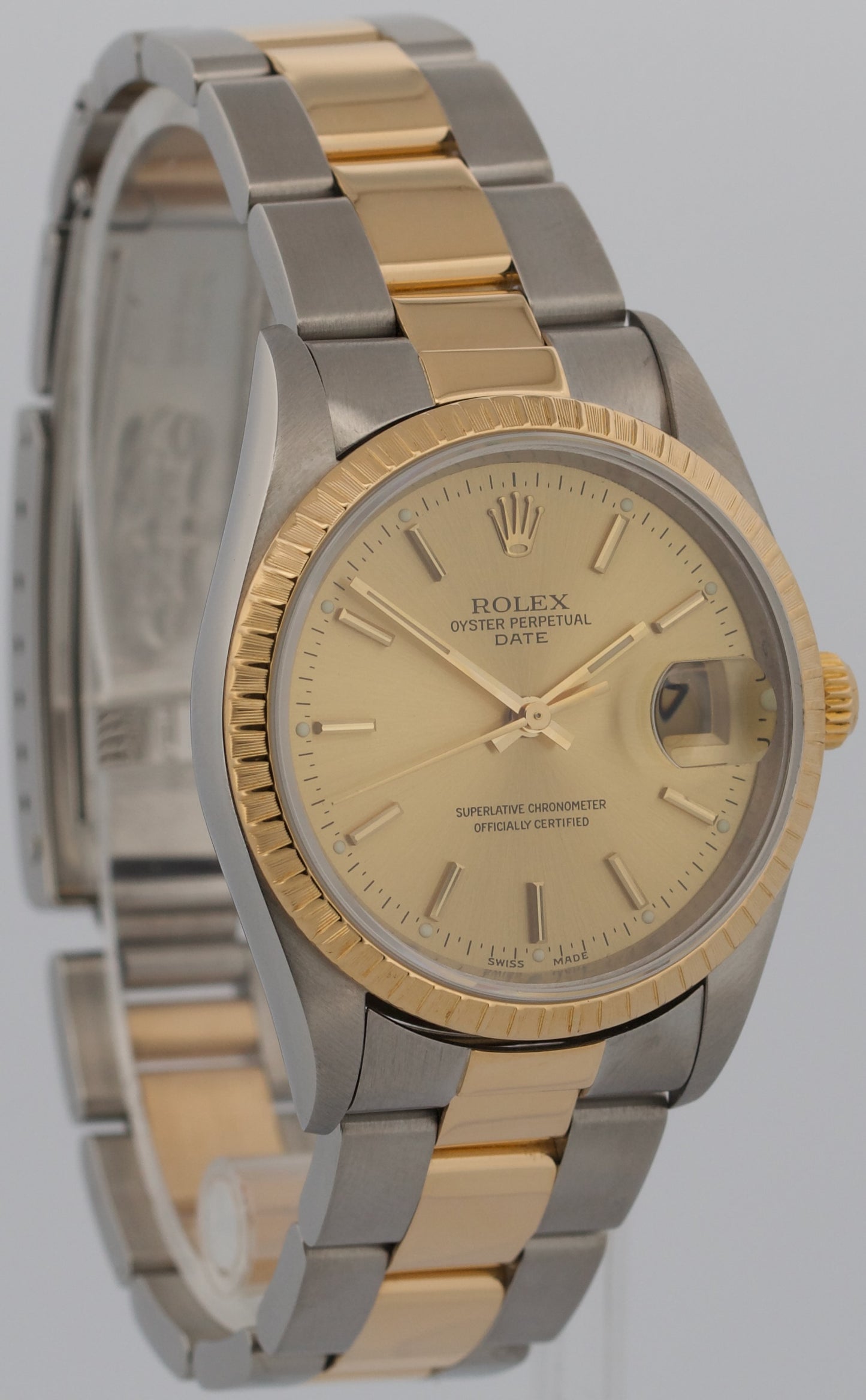 Rolex Oyster Perpetual Date 34mm CHAMPAGNE 18K Steel Engine-Turned Oyster 15233