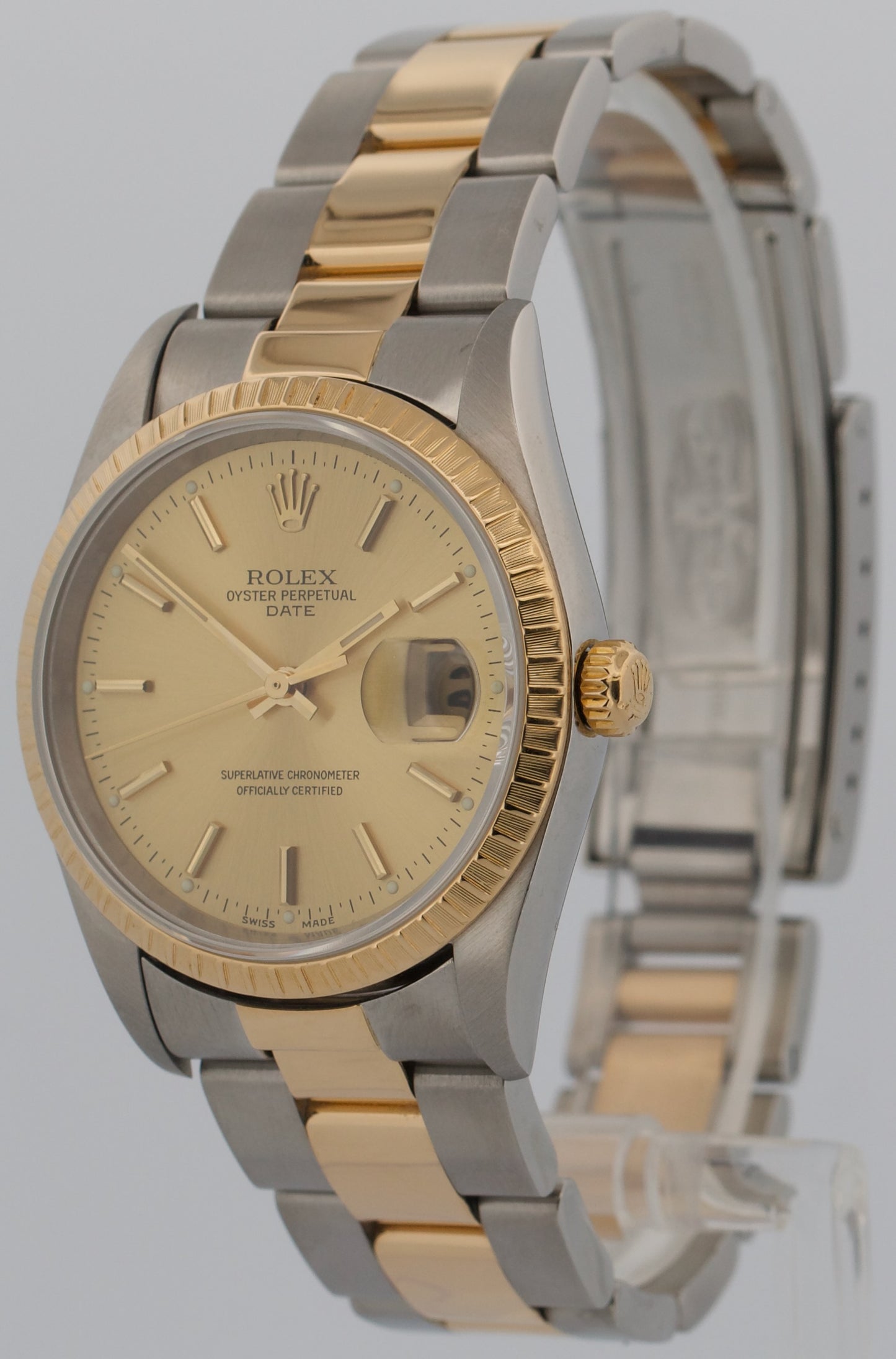 Rolex Oyster Perpetual Date 34mm CHAMPAGNE 18K Steel Engine-Turned Oyster 15233