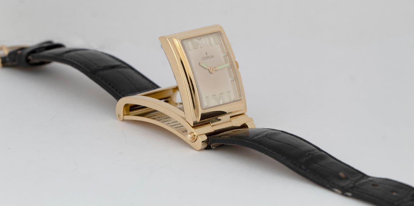 MINT Corum Tabogan 18K Yellow Gold Quartz Silver Dial 64.151.56 Flip-Up Watch